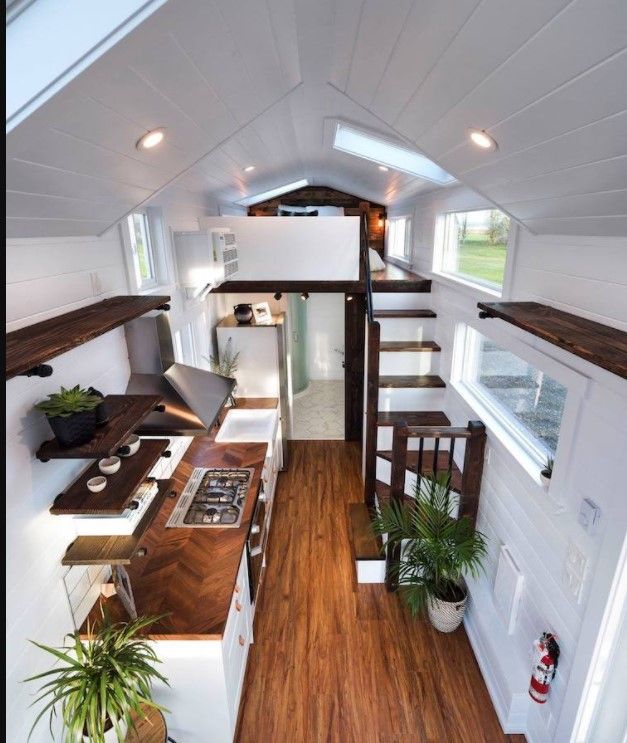 Tiny home interior with kitchen, loft and stairs